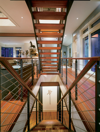 Tony and Sally’s antique colonial furniture—including the 18th-century horse weathervane—contrasts with sleek 21st-century steel beams, windows and opaque-glass walls. The hardwood floors are FSC-certified Brazilian cherry with a natural oil finish.
